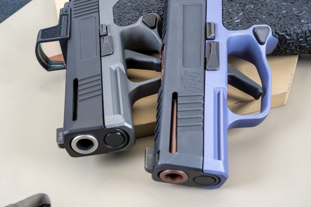 Pair of Sig handguns fron view
